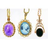 A 9CT GOLD PENDANT SET WITH A GLASS CAMEO ON SILVER NECKLET, AN AMETHYST CABOCHON PENDANT IN GOLD ON