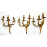 ONE AND A PAIR OF MATCHING ORMOLU THREE BRANCH WALL LIGHTS, IN LOUIS XV STYLE, 27CM APPROX, MID 20TH