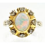 AN OPAL AND DIAMOND CLUSTER RING, IN GOLD WITH PIERCED HOOP, SIZE M, 6.3G