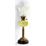 A VICTORIAN BRASS OIL LAMP WITH LIMED GREEN MOULDED GLASS FOUNT, BRASS BURNER AND ETCHED GLASS