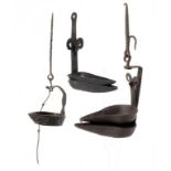 TWO SCOTTISH WROUGHT IRON WHALE OIL LAMPS OR CRUSIES, 18TH C with valve, 18 and 33cm h overall and a