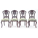 A SET OF FOUR VICTORIAN CARVED MAHOGANY SALON CHAIRS