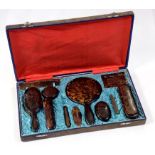 A CHINESE TORTOISESHELL DRESSING TABLE SET, CASED, EARLY 20TH CENTURY