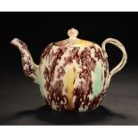 A STAFFORDSHIRE OR YORKSHIRE TORTOISESHELL GLAZED CREAMWARE OVOID TEAPOT AND COVER, C1765 with Leeds