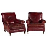 A PAIR OF VICTORIAN RED LEATHER ARMCHAIRS, C1900 on mahogany feet, with cushions, 82cm h ++The