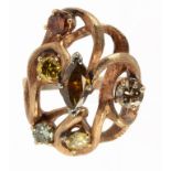 A FANCY COLOURED DIAMOND FIVE STONE ASYMMETRICAL including cinnamon and cognac diamonds, in openwork