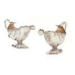 A FINE PAIR OF GEORGE II ROCOCO SILVER SHELL SHAPED SAUCE BOATS with gadrooned rim, on shell foot,