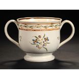 A PRATT WARE LOVING CUP, C1820 painted to either side with stylised flowers, 11.5cm h ++In fine