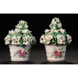 A PAIR OF DERBY FLOWER POTS, C1765 the hooped pots painted with loose bouquets and scattered