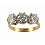 A DIAMOND RING, with three round brilliant cut diamonds, in gold marked 18ct & PLAT, 3.7g, size