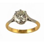 A DIAMOND SOLITAIRE RING with a round brilliant cut diamond, in gold marked 18ct, 3.6g, size M ++