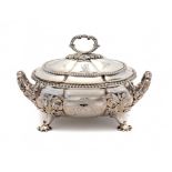 A GEORGE IV SILVER GADROONED SAUCE TUREEN AND COVER engraved with armorials, by William, Charles &