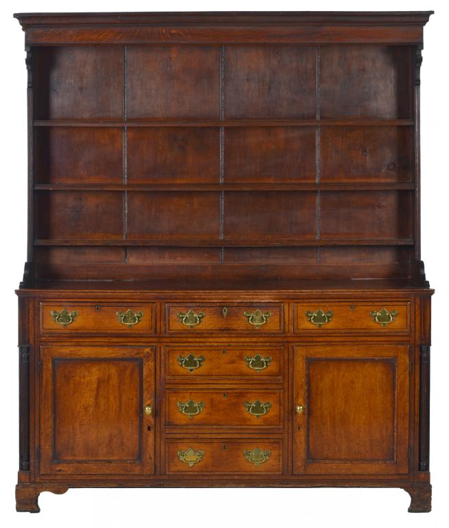 A GEORGE III OAK AND LINE INLAID DRESSER, NORTH WALES, FIRST HALF 19TH C with boarded rack, fitted