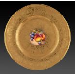A ROYAL WORCESTER PLATE, C1970 painted with a central still life of fruit, indistinctly signed,