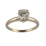 A DIAMOND SOLITAIRE RING with a round brilliant cut diamond, in white gold marked 14k, 2.9g, size