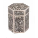 A CHINESE SILVER HEXAGONAL REPOUSSÉ CANISTER AND COVER, 19TH/EARLY 20TH C with panels of bamboo, 9cm
