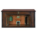 AN OAK ARCHITECTURAL MODEL OF AN 18TH CENTURY PANELLED ROOM, C1930 with chimneypiece and alcoves,