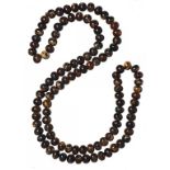 A NECKLACE OF 108 ROOT AMBER BEADS 144g