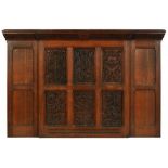 A SCOTTISH ARTS & CRAFTS OAK OVERMANTLE CARVED BY GEORGE SCOTT LAMB FOR THE DRAWING ROOM OF HIS
