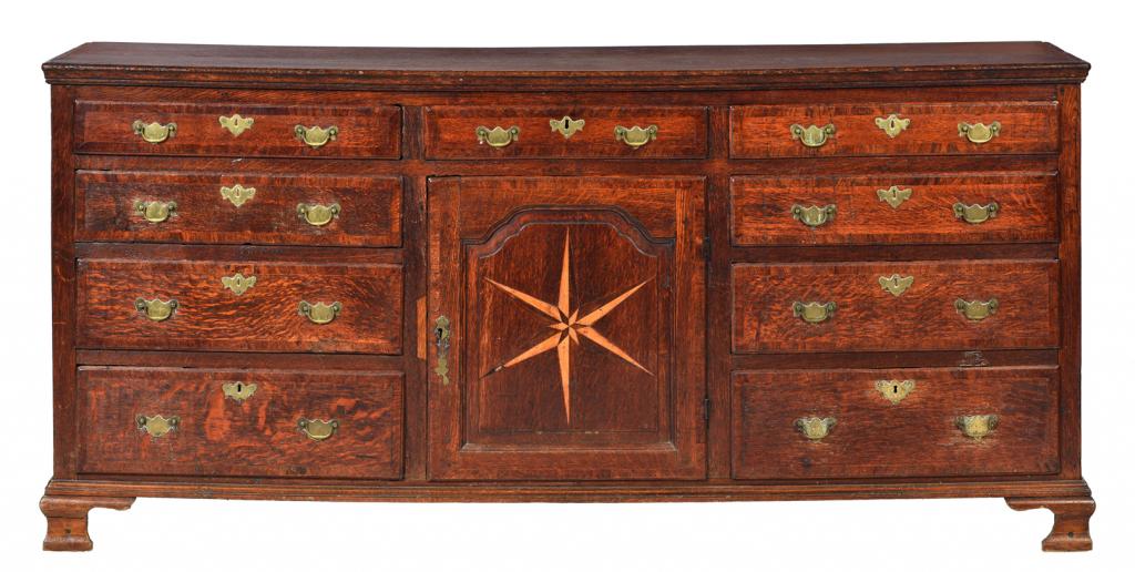 A GEORGE III OAK DRESSER, LATE 18TH C crossbanded throughout, the raised and fielded ogee arch