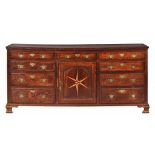 A GEORGE III OAK DRESSER, LATE 18TH C crossbanded throughout, the raised and fielded ogee arch