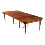 A GEORGE IV MAHOGANY DINING TABLE, C1830 with five leaves in a leaf cabinet and a narrower leaf on