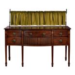 A VICTORIAN MAHOGANY AND INLAID SERPENTINE SIDEBOARD, C1900 with brass gallery, fitted with