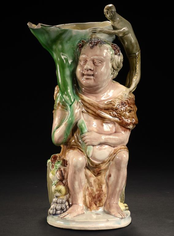 A RALPH WOOD EARTHENWARE BACCHUS AND PAN JUG TRADITIONALLY ASCRIBED TO RALPH WOOD AND MODELLED BY