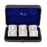 A SET OF SIX VICTORIAN SILVER NAPKIN RINGS 5cm w, by Josiah Williams & Co, London 1895, cased,