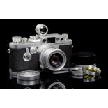 A LEICA IIIG CAMERA No 981712 with Elmar f.2.8 5cm lens, lens cap, lens hood, viewfinder, cable