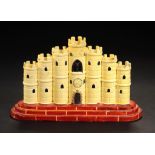 A YELLOW GLAZED EARTHENWARE SHAM CASTLE SPILL HOLDER, C1830 of seven turrets on stepped brick red