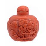 A CHINESE CORAL SNUFF BOTTLE, CIRCA 19TH/20TH C carved with a continuous mountain landscape,