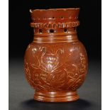 A NOTTINGHAM SALTGLAZED BROWN STONEWARE PUZZLE JUG, DATED 1717 incised with a tulip flanked by the