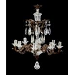 A CAST BRASS AND CUT GLASS CHANDELIER, EARLY 20TH C of eight lights on acanthus wrapped scrolling