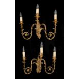A PAIR OF ENGLISH GILTWOOD AND PLASTER NEO CLASSICAL STYLE WALL LIGHTS, C1900 of leafy scrolling