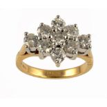 A DIAMOND CLUSTER RING with nine round brilliant cut diamonds in 18ct gold, 6.8g, size N ++In very