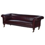 A VICTORIAN LEATHER CHESTERFIELD SOFA on turned mahogany feet with brass castors, re-upholstered