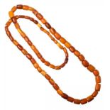 A NECKLACE OF 79 AMBER BEADS 165.8g ++++
