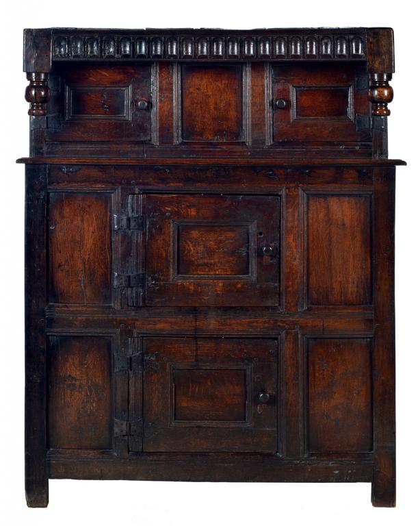 AN ENGLISH OR WELSH OAK LIVERY CUPBOARD, C1700 with nulled frieze and bulbous pendants, the four