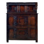 AN ENGLISH OR WELSH OAK LIVERY CUPBOARD, C1700 with nulled frieze and bulbous pendants, the four
