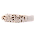 A MUGHAL INDIAN IVORY DAGGER HILT, 18TH/19TH C well carved with a contorted figure within