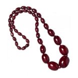 A NECKLACE OF 42 FATURAN BEADS 66.5g