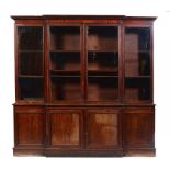 A VICTORIAN MAHOGANY BREAKFRONT BOOKCASE, LATE 19TH C fitted with adjustable shelves, 242cm h; 57