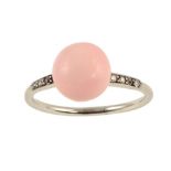 A PINK PEARL RING WITH DIAMOND SHOULDERS, C1930 the button shaped pearl of 8mm approx, 3.2g, size