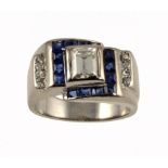 A SAPPHIRE AND DIAMOND COCKTAIL RING the larger emerald cut diamond with surround of calibré cut