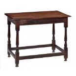 A WILLIAM III OAK SIDE TABLE, C1700 on turned legs united by moulded stretchers, 68cm h; 53 x