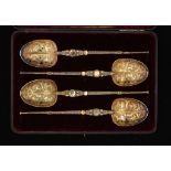 A FINE SET OF FOUR VICTORIAN SILVER GILT REPLICAS OF THE ANOINTING SPOON 25.5cm l, by Edward Barnard