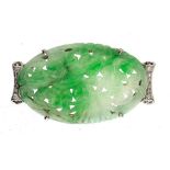 A JADEITE AND DIAMOND BROOCH, C1930 the plaque carved and pierced with flowers, 2.4 x 4.3cm, 9.