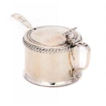 A GEORGE III SILVER GADROONED MUSTARD POT crested, blue glass liner, 6.5cm h, by Matthew Boulton,