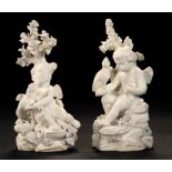 A PAIR OF DERBY BISCUIT FIGURES OF CUPID SEATED WITH DOG OR FALCON, C1770 13cm h, incised No 213 ++